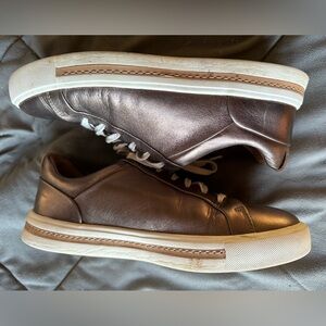Women’s bronze unstructured Clarks sneakers. Size 7.